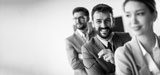 smiling-young-business-people-standing-row-together